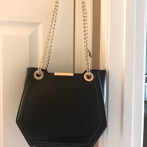 Leather purse with gold hardware.